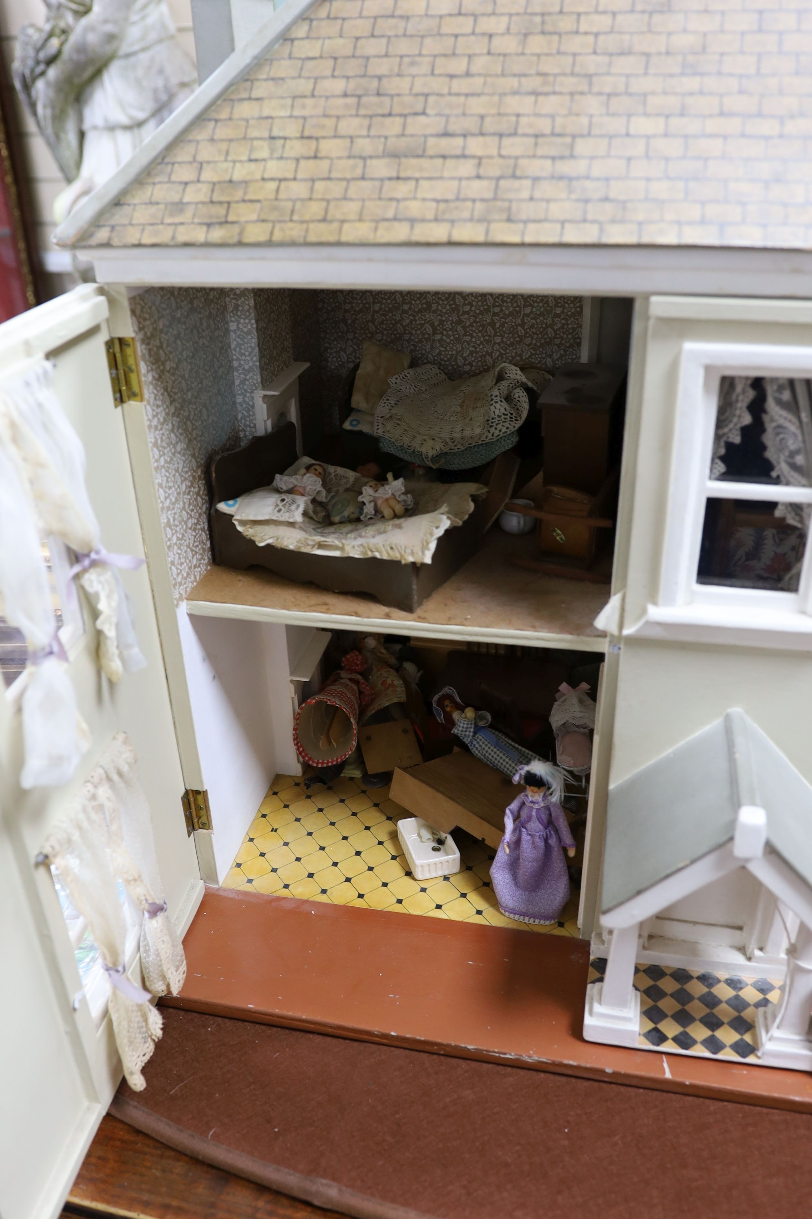 A dolls house, length 74cm, depth 39cm, height 66cm